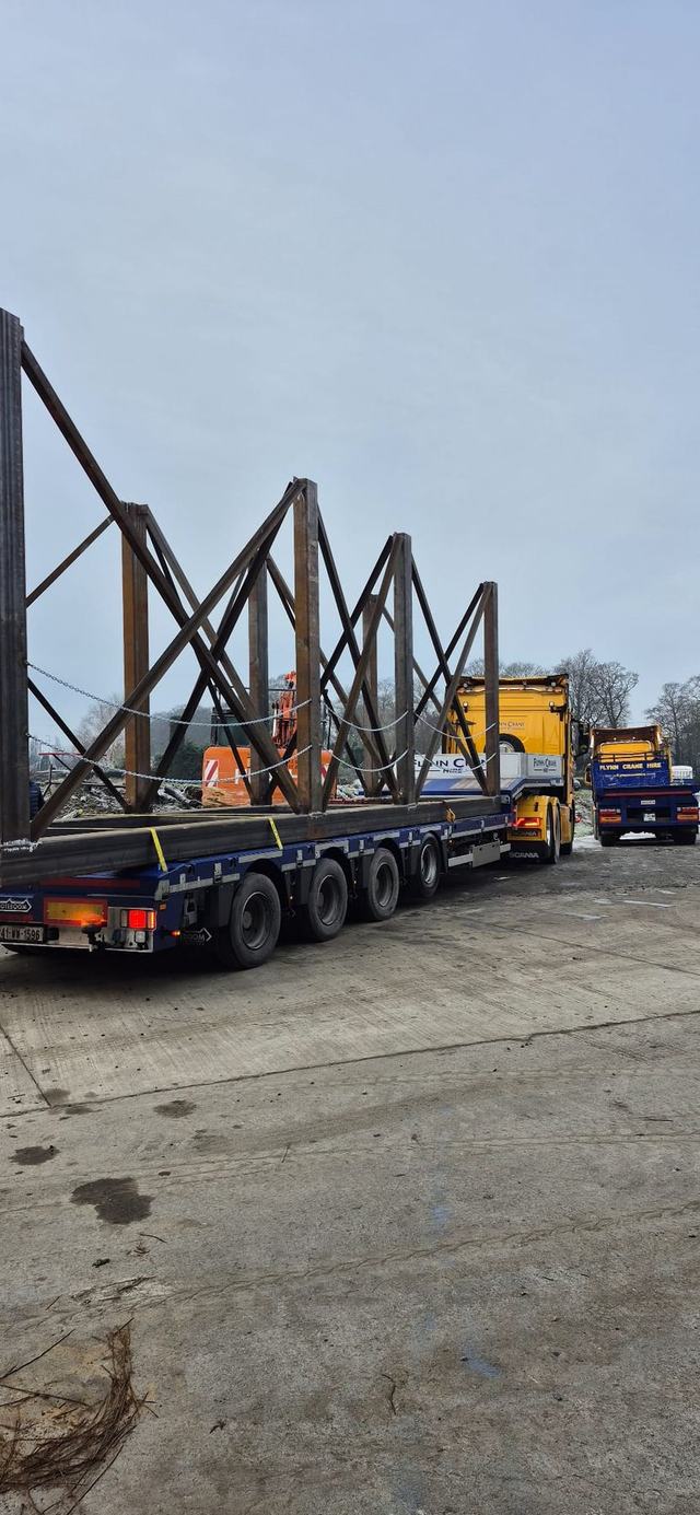 Steel truss frames loaded on a lorry for delivery