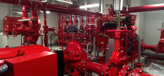 Plant room with red pumps and pipework
